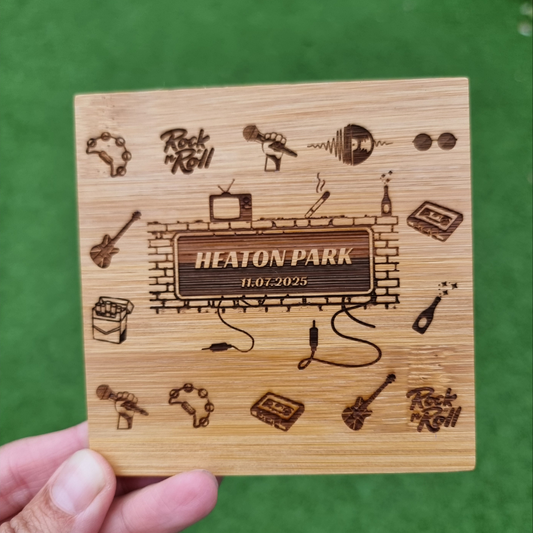 Wooden coaster with engraved design and text 'Heaton Park' on a green background