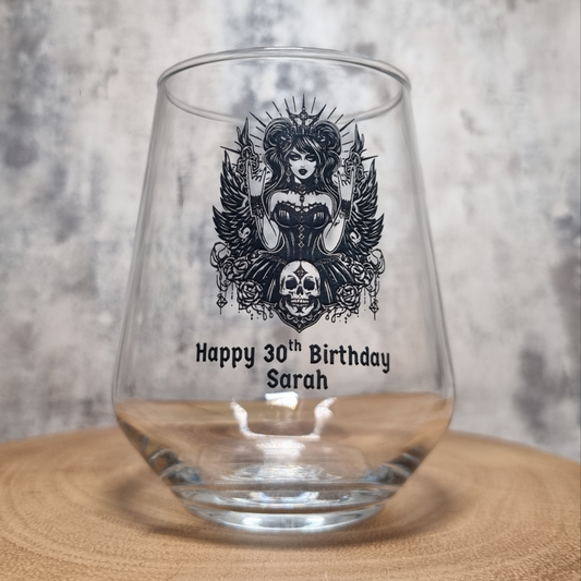 Personalised 30th birthday wine glass with custom name and gothic goddess design filled with wine