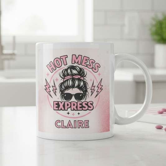 Personalised Hot Mess Express 11oz white ceramic mug featuring a messy bun mum illustration with custom name printed, funny gift for mums