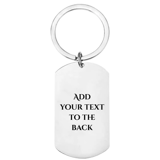 Stainless steel keyring with campervan engraving and text saying “On an Adventure Before Dementia”