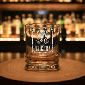Close-up of personalised whiskey glass showing printed name and age — premium birthday gift for men
