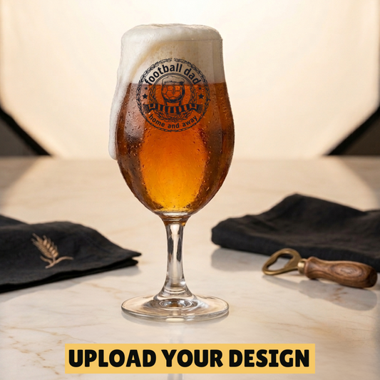 Personalised 1-pint chalice beer glass on wooden board showing YOUR LOGO HERE placeholder — upload any design or logo to be printed on the glass