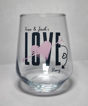 Personalised Love Story couples glass printed with names — bold LOVE design with gold heart and arrow by First Glass Designs UK