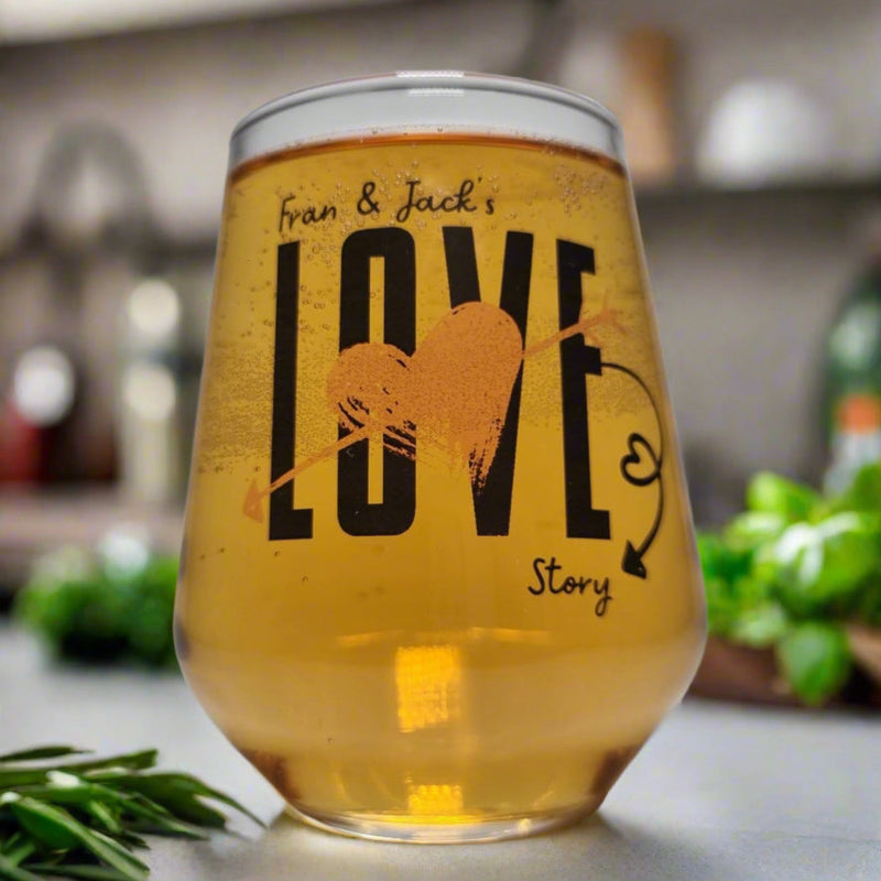Personalised Love Story couples glass printed with names — bold LOVE design with gold heart and arrow by First Glass Designs UK
