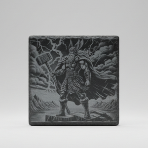 Slate coaster laser engraved with Thor wielding Mjolnir hammer, storm and mountain landscape, Norse mythology design