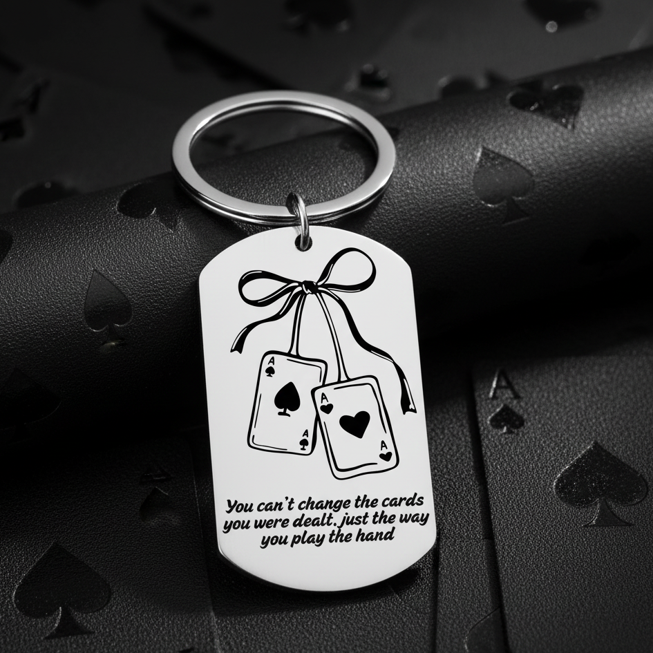 Keychain with playing card design and motivational quote on a white background