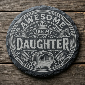 Round slate coaster with 'Awesome like my daughter' text on a wooden surface