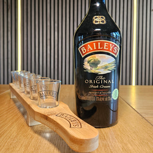 Close up of six custom printed shot glasses on personalised bamboo paddle, upload your own design party gift