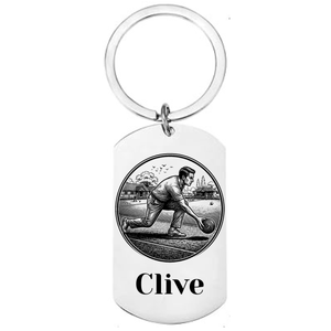 Personalised lawn bowls keyring laser engraved stainless steel dog tag with male bowls player delivery scene in circular medallion design and personalised name on white background