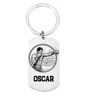 Personalised boxing keyring laser engraved stainless steel dog tag with boxer throwing punch in circular medallion design and personalised name on white background