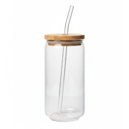 Clear glass tumbler with a bamboo lid and straw on a white background