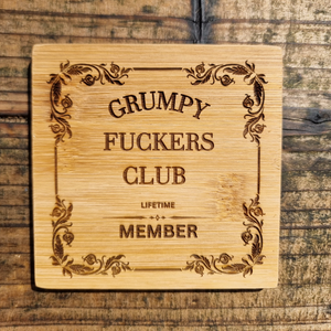 Engraved wooden sign reading “Grumpy F*ckers Club Lifetime Member” with decorative vintage border, laser engraved on natural wood plaque with rustic finish.
