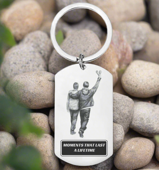 Personalised stainless steel Oasis keyring with concert opening night design, engraved fan gift with optional custom message on the back.