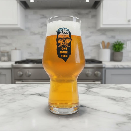 One More Beer custom printed personalised beer glass with bold 
hipster skull and beard design on a tall stemless beer glass in a kitchen setting