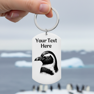 Keychain with penguin design and customizable text on a white background