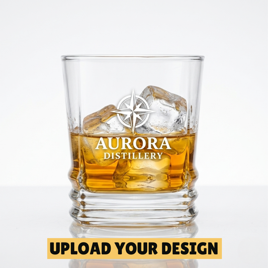 Personalised 315ml ribbed whiskey rocks glass with custom uploaded Aurora Distillery logo design filled with whiskey and ice