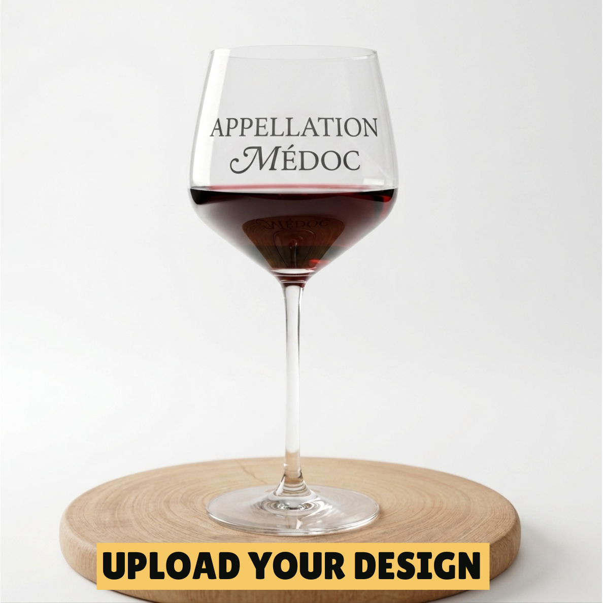 Personalised 650ml large stemmed wine glass with custom uploaded Appellation Medoc design filled with red wine on wooden board