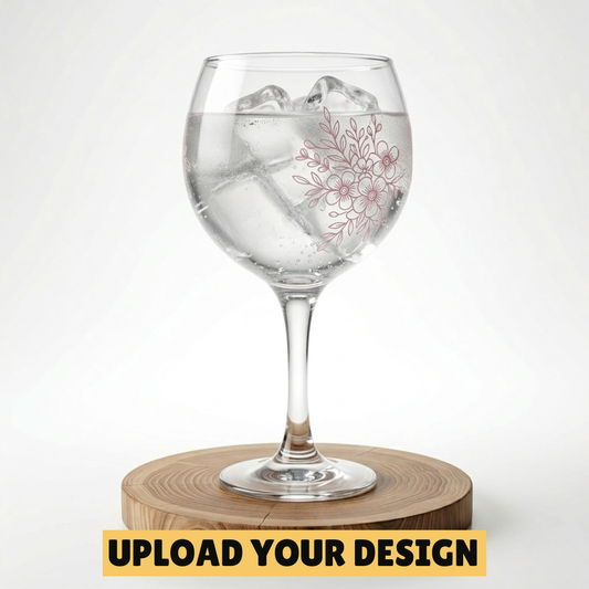 Personalised Copa balloon gin glass with custom uploaded floral design filled with ice and gin on wooden board, unique gift for her