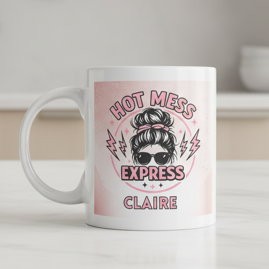 Personalised Hot Mess Express 11oz white ceramic mug featuring a messy bun mum illustration with custom name printed, funny gift for mums