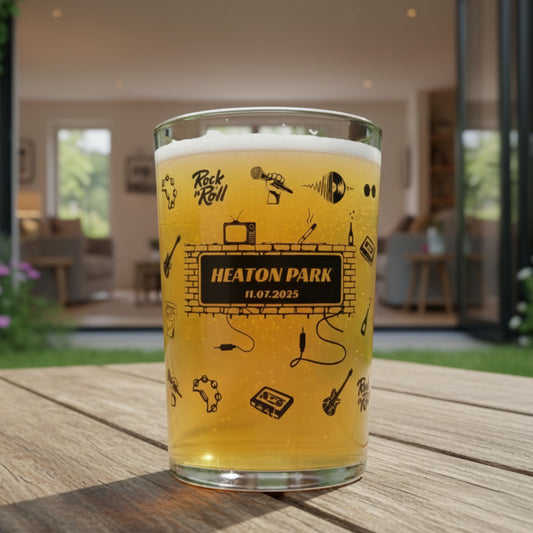 Personalised engraved 18oz beer glass with a Union Jack guitar design, a custom Britpop concert souvenir gift for music fans, ideal for Heaton Park Manchester show attendees