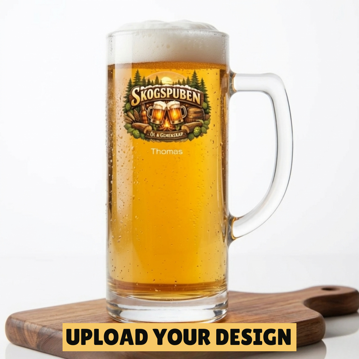 Personalised glass pint stein with handle printed with a custom craft beer logo design and personalised name below — example of uploaded design with text addon, shown on wooden slice