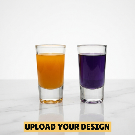 Personalised set of two 30ml shot glasses filled with orange and purple drinks on marble surface, unique custom printed party gift