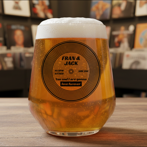 Personalised vinyl record beer glass with couple names and song title printed on the design