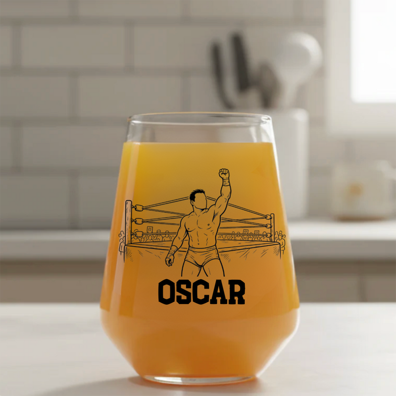 Personalised wrestling stemless beer glass custom printed with 
champion celebration scene showing wrestler raising fist in packed 
ring with personalised name below