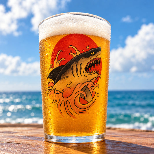 Shark pint glass custom printed with a tattoo style shark, red sun and wave design