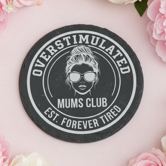 Laser engraved slate coaster with the text “Overstimulated Mums Club – Estd. Forever Tired”.