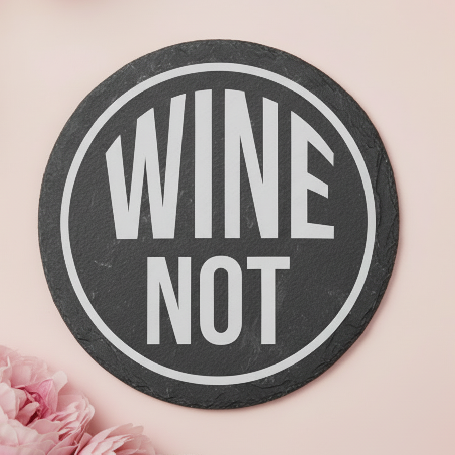 Laser engraved slate coaster with the text “WINE NOT”.