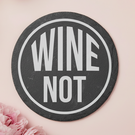 Laser engraved slate coaster with the text “WINE NOT”.