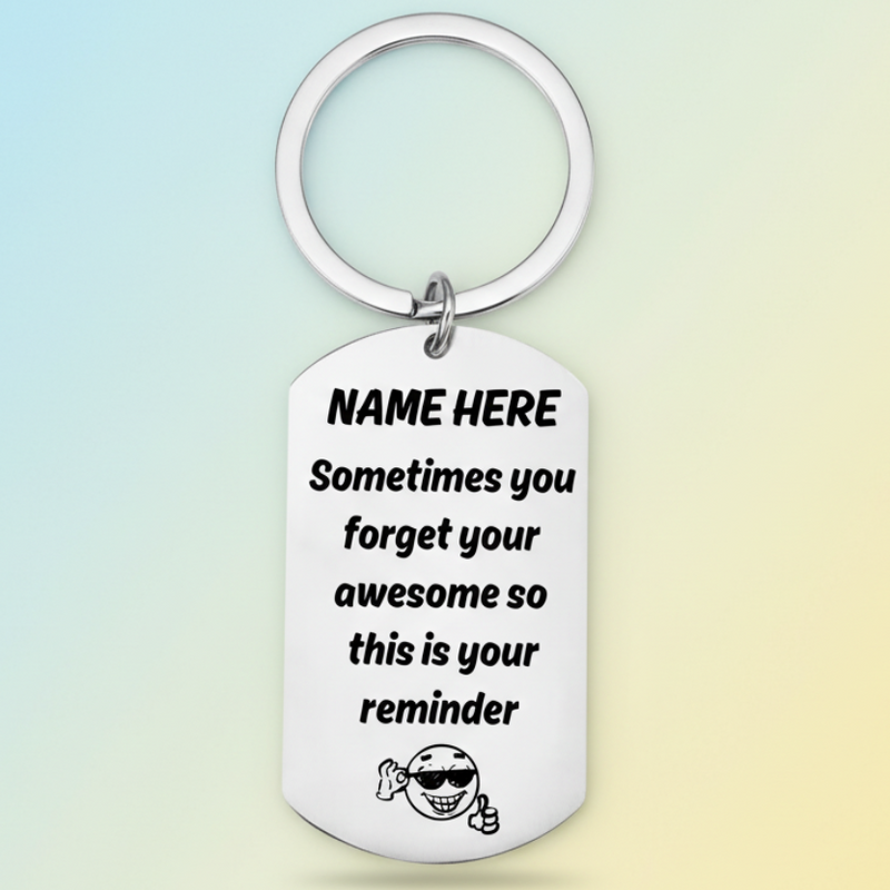 Personalised 'you're awesome' keyring with custom name placeholder, displaying the message 'Sometimes you forget your awesome so this is your reminder' with a smiling character wearing sunglasses