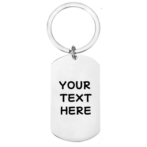 Reverse of personalised skateboarding stainless steel dog tag keyring showing laser engraved personal message on white background