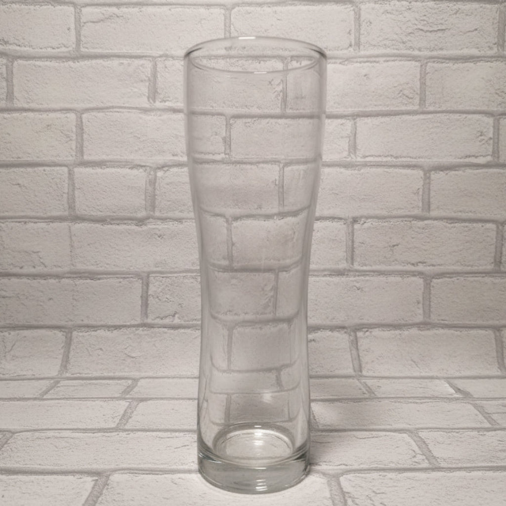 Plain 1-pint Aspen schooner beer glass on wooden surface shown before custom design is applied — wide-bodied shape with handle-free design
