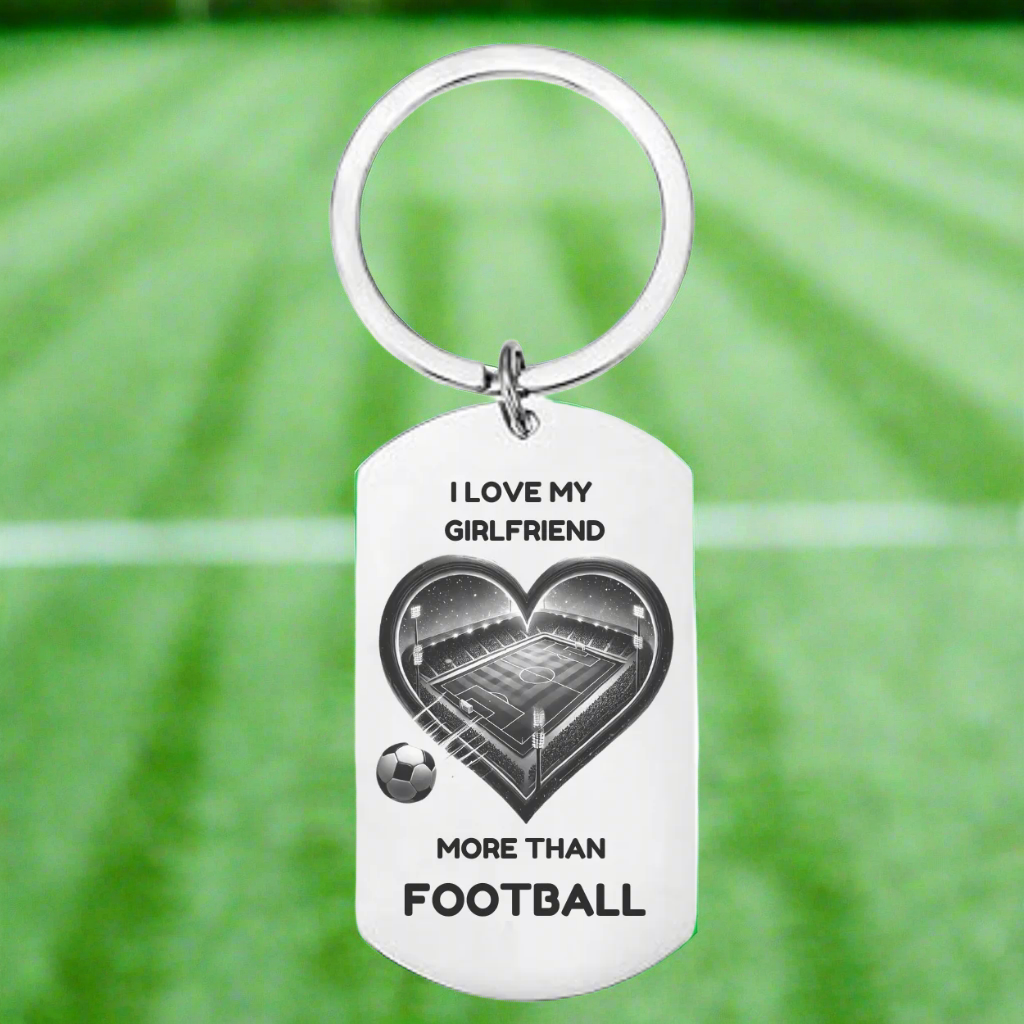 Personalised stainless steel keyring with heart-shaped football pitch design and “I Love My Girlfriend More Than Football” engraving – romantic gift for boyfriend from girlfriend