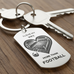 Personalised stainless steel keyring with heart-shaped football pitch and “I Love My Wife More Than Football” engraving – romantic gift for husband from wife