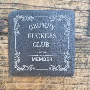 laser engraved slate coaster with “Grumpy Fuckers Club” text and floral border – funny sarcastic drink coaster gift for grumpy people, rustic home or office décor