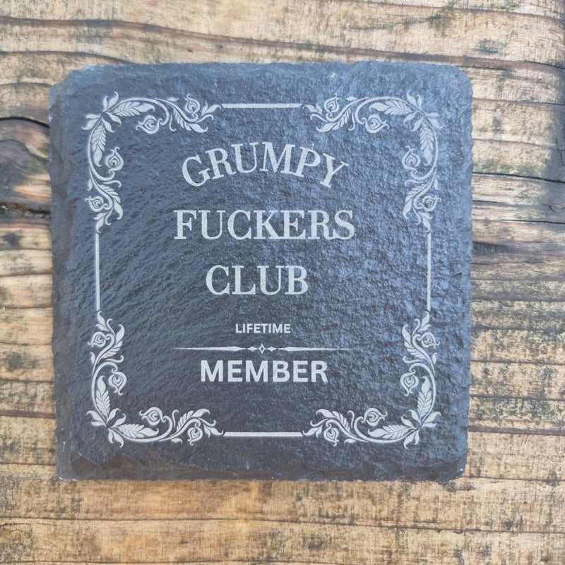 laser engraved slate coaster with “Grumpy Fuckers Club” text and floral border – funny sarcastic drink coaster gift for grumpy people, rustic home or office décor