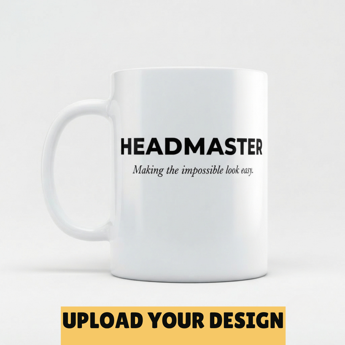 A white ceramic mug with black printed text reading 'HEADMASTER' and the subtitle 'Making the impossible look easy.' on a light gray background.