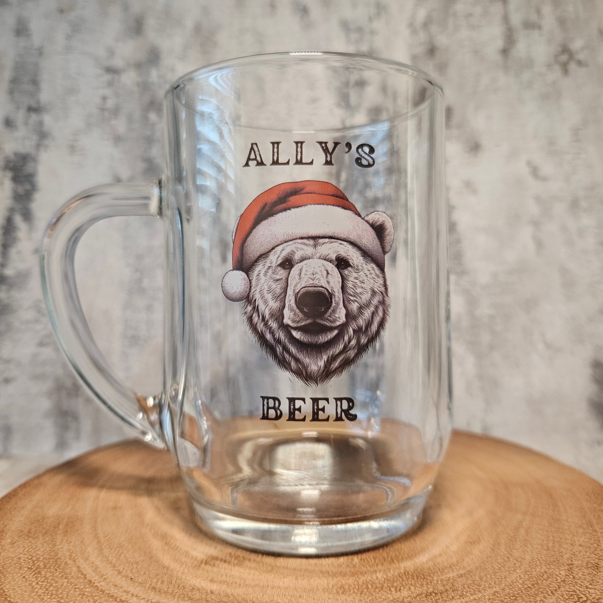 Personalised pint glass printed with a polar bear in a Santa hat and the text Daddy's Beer — custom Christmas glassware by First Class Design