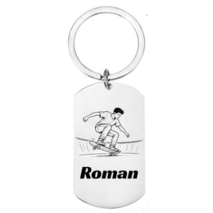 Personalised skate ramp laser engraved stainless steel dog tag keyring with dynamic front-facing skater illustration and personalised name on white background