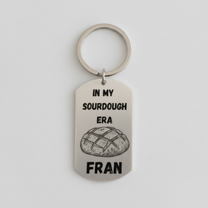 Personalised stainless steel keyring laser engraved with In My Sourdough Era text, name, and bread illustration